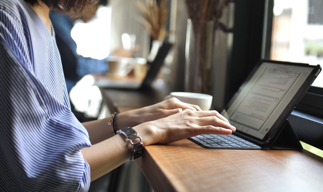 Woman writing a blog on her laptop