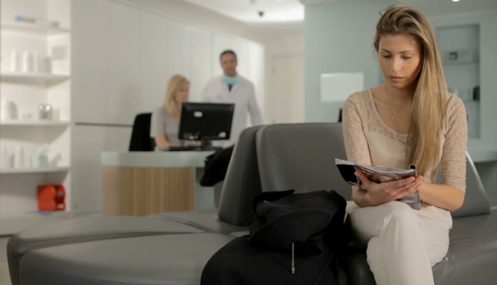 Girl reading in a clinic's waiting room