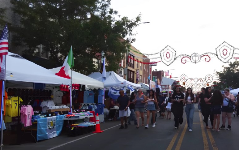 A vibrant street fair full of people walking