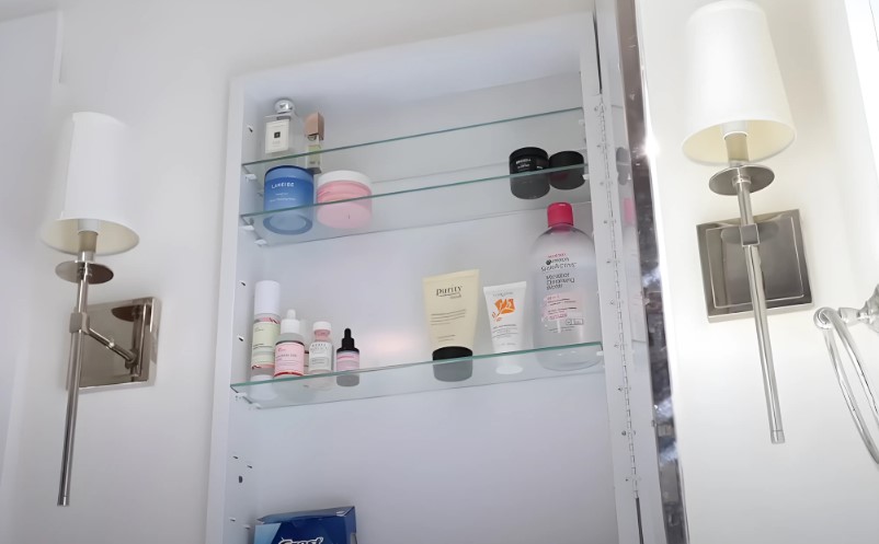 Tall bathroom shelf with products on it