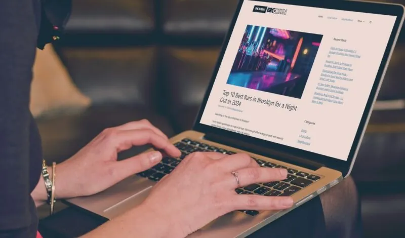 Woman blogger working on a laptop