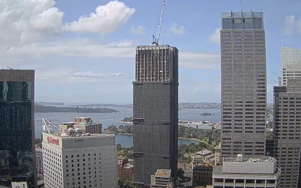 Construction wraps around a tall skyscraper