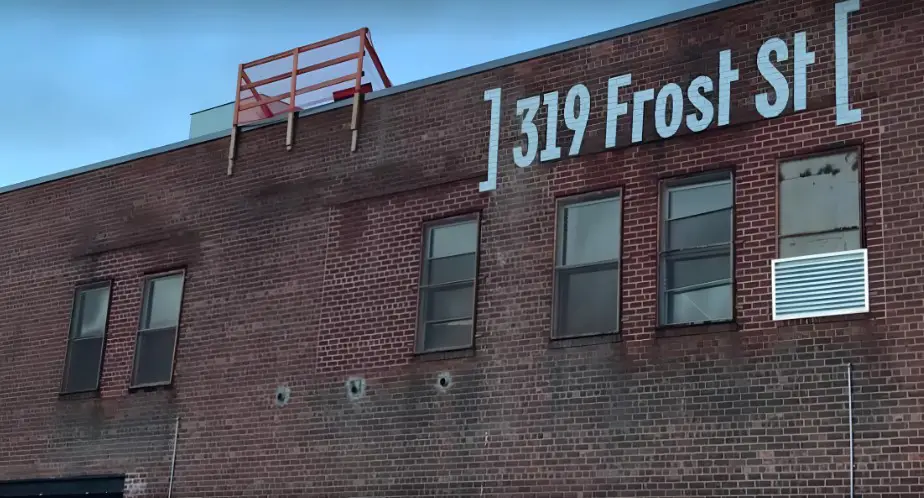 A weathered brick building, 319 Frost St